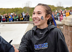 Lily Cridge&rsquo;s joy has no limits as the junior from Bishop Chatard High School in Indianapolis celebrates winning the girls&rsquo; state championship cross country race of the Indiana High School Athletic Association on Oct. 30. (Submitted photo)
