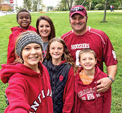 Brooklyn Ortman holds the camera for a selfie with her family&mdash;her siblings Holden, left, Brynklie and Hudson, and her parents, Alison and Jed. The couple adopted Holden five years ago. (Submitted photo)