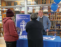 Dan Thompson, director of business operations at Bishop Chatard High School in Indianapolis, speaks with visitors at a Nov. 4 open house about tuition assistance options, including Indiana&rsquo;s newly expanded Choice Scholarship Program.&nbsp;(Submitted photo)