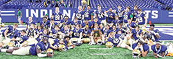 The seniors on the football team of Cathedral High School in Indianapolis share the joy after their squad won the Indiana High School Athletic Association&rsquo;s Class 5A state championship on Nov. 26 at Lucas Oil Stadium in Indianapolis. (Submitted photo)