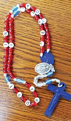 A Divine Mercy chaplet with beads spelling out &ldquo;Jesus I Trust in You&rdquo; is shown here. The chaplet was made by Kathy Eberle of St. John Paul II Parish in Sellersburg. (Photo by Natalie Hoefer)