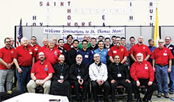 Members of Saint Thomas More Knights of Columbus Council 7431 at St. Thomas More Parish in Mooresville, seminarians at Bishop Simon Brut&eacute;&nbsp;College Seminary in Indianapolis and several priests pose for a group photo after the March 28 Seminarian Appreciation Dinner and Priestly Vocations Event. (Submitted photo by Julie Lesh)
