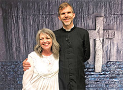 Gayle Griffiths beams with Father Jonathan Meyer, co-pastor of All Saints Parish in Dearborn County, after she was received into the full Communion of the Church during the parish&rsquo;s Easter Vigil Mass on April 16. (Submitted photo by Cindy White)