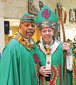 Divine Word Father Charles Smith and Archbishop Charles C. Thompson smile after celebrating the closing Mass for the National Black Catholic Men&rsquo;s Conference at St. Rita Church in Indianapolis on Oct. 15. The gathering was renamed in honor of Father Charles&rsquo; late twin brother, Divine Word Father Chester Smith, who co-founded the conference in 2004. (Submitted photo by Frances Guynn)