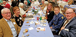 Craig and Diana Moorman, left, of St. Rose of Lima Parish in Franklin, and Michele, Joshua and Brian Neary of St. Charles Borromeo Parish in Bloomington pose for a group photo during a United Catholic Appeal dinner at the Archbishop Edward T. O&rsquo;Meara Catholic Center in Indianapolis on Oct. 27. (Photo by Natalie Hoefer) 