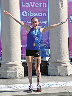 Lily Cridge of Bishop Chatard High School in Indianapolis celebrates finishing first&mdash;for the second year in a row&mdash;in the Indiana girls&rsquo; high school cross-country state championship race on Oct. 29 in Terre Haute. (Submitted photo)