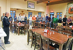 Father Joseph Moriarty, second from right, rector of Bishop Simon Brut&eacute; College Seminary in Indianapolis, speaks to seminarians and Castle Night participants on Nov. 16, 2022, in the seminary dining hall. Sponsored by the archdiocesan Office of Vocations, Castle Night brings high school boys open to a possible priestly vocation to the seminary for prayer, a meal and time shared with seminarians and other high schoolers like themselves. (Photo by Sean Gallagher)