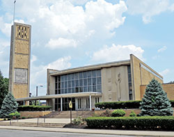 With its clean lines, barely bowed front, large windows and minimal ornamentation, St. Rita Church in Indianapolis, built in 1958-59, is a prime example of Mid-Century Modern architecture. For this reason and for the parish&rsquo;s spiritual, social and historical impact, the parish has received several preservation grants, including a matching grant to restore its bell tower, seen at left in this photo. (Submitted photo by Caleb Legg)