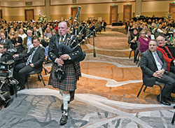 Bagpiper Les Miller plays a mournful rendition of &ldquo;Amazing Grace&rdquo; during an emotional tribute to the late Deacon Marc Kellams and his late daughter, Katie Kellams Reed, at the archdiocese&rsquo;s Legacy Gala at the JW Marriott in Indianapolis on Feb. 10. (Photo by Rob Banayote)