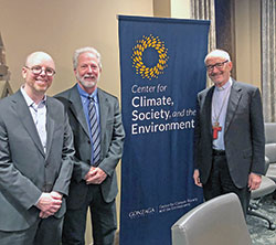 John Mundell, center, a member of Our Lady of Lourdes Parish in Indianapolis, poses with Brian Henning, left, and Cardinal Michael F. Czerny in a recent event at Gonzaga University in Spokane, Wash., to help launch &ldquo;Our Common Home: A Guide to Caring for Our Living Planet.&rdquo; Mundell is the director of the Laudato Si&rsquo; Action Platform, a part of the Vatican&rsquo;s Dicastery for Integral Human Development, which is led by Cardinal Czerny. Henning is a professor of philosophy and environmental studies at Gonzaga. (Submitted photo)