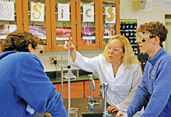 Amanda Horan shows the joy that teaching brings her as she works with students during a lab in the Honors Chemistry class she teaches at Bishop Chatard High School in Indianapolis. Horan is this year&rsquo;s recipient of the Saint Theodora Excellence in Education Award, the highest honor given to an educator in the archdiocese. (Photo by John Shaughnessy)