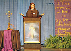 Sister Mary Augustine McMenamy, a member of the Sisters of Reparation to the Most Sacred Heart of Jesus in Steubenville, Ohio, speaks at the Indiana Catholic Women&rsquo;s Conference on March 11 at the Indiana Convention Center in Indianapolis. (Photo by Jennifer Lindberg)