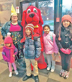Showing her &ldquo;young at heart&rdquo; spirit in 
2019, Sarah Jean Watson, then principal of St. Lawrence School in Indianapolis, gets in on the fun with some of her students for a photo opportunity with Clifford the Big Red Dog. (Criterion file photo)