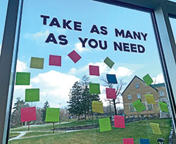 On a window outside the Unified Media Center at Cathedral High School in Indianapolis, members of the school&rsquo;s Empowering Healthy Minds Club stick Post-it notes for affirmation and encouragement. (Submitted photo)