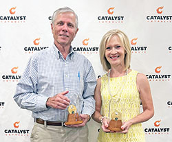 Jon Train, left, and Donna Curry pose with the St. John Bosco awards they received during the Catalyst Catholic Gala held on Aug. 26 at Huber&rsquo;s Orchard & Winery in Borden. Catalyst Catholic is the office of youth ministry in the New Albany Deanery. (Submitted photo by Catalyst Catholic&rsquo;s CJ Smith intern, Annika Martin)