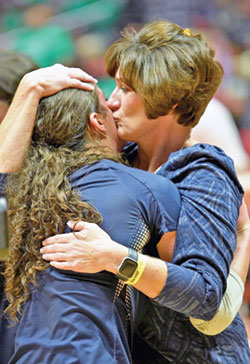 One of the great joys of Terri Purichia&rsquo;s 25 year of coaching at Our Lady of Providence High School in Clarksville has been sharing seasons and special moments with her three daughters, Maggie, Anna and Grace. Here, she shares a hug with Grace after the team won Indiana&rsquo;s 3A state championship in 2022. (Submitted photo)