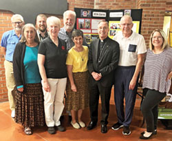 Members of the archdiocese&rsquo;s Creation Care Ministry pose with Archbishop Charles C. Thompson at St. Thomas Aquinas Parish in Indianapolis on Sept. 26, the day the archbishop celebrated the archdiocese&rsquo;s annual Green Mass there. Posing in the front row are Rosemary Spalding, left, Sharon Horvath, Benedictine Sister Sheila Fitzpatrick, Archbishop Charles C. Thompson, Joe Shierling and Laura Sheehan. In the back row are Andy Pike, left, Andy Miller and John Mundell. Creation Care Ministry members not in the photo are Sarah Mundell and Julie Reyes. (Submitted photo)