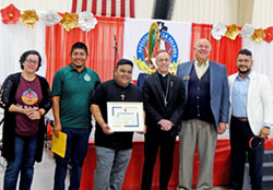 Juanita Barrera, left, Luis Xalanda and Reynaldo Gerardo, all members of St. Gabriel the Archangel Parish in Indianapolis, are pictured on Sept. 30 during a Bible conference at St. Michael the Archangel Parish in Indianapolis with Archbishop Charles C. Thompson; Ken Ogorek, executive director of the archdiocesan Secretariat for Evangelizing Catechesis; and Felix&nbsp;Navarrete, the archdiocese&rsquo;s Hispanic ministry coordinator. The St. Gabriel parishioners are members of the board of Apostoles de la Palabra (Apostles of the Word) and were recognized for their service to Hispanic families in the archdiocese&rsquo;s evangelization and catechesis mission. (Photo by Mike Krokos)