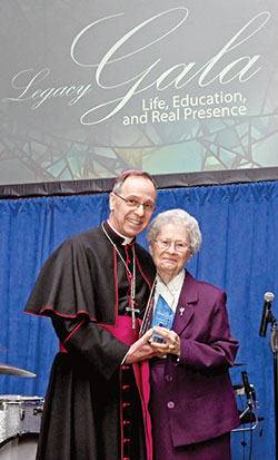 Archbishop Charles C. Thompson poses with Franciscan Sister Shirley Gerth after she received the archdiocese&rsquo;s Legacy Award at the Legacy Gala at the JW Marriott in Indianapolis on Feb. 9. (Photo by Rob Banayote)