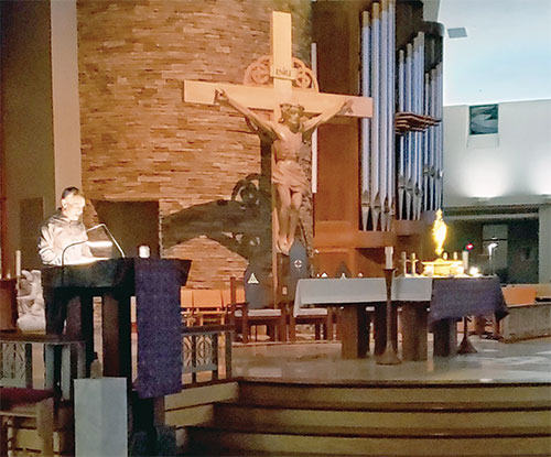 Francis Ray reads aloud from the Bible in the presence of Christ in the Blessed Sacrament in St. Malachy Church in Brownsburg early on the morning of March 12 as part of the parish&rsquo;s The Word Became Flesh Bible Marathon from March 10-14, an event designed to highlight Christ&rsquo;s presence in the word and in the Eucharist. (Photo by Natalie Hoefer)