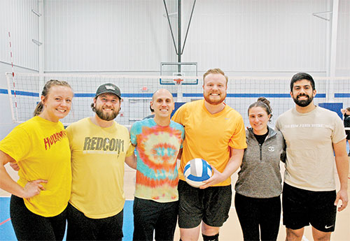IndyCatholic volleyball league offers a winning combination of community, faith and friendship for young adults, including the teammates of &ldquo;The Yellow Swarm&rdquo;: Allison Hildebrand, left, Kurtis Wagner, Derek Sanders, Kevin Bedel, Mary Kate Thatcher and Michael Frausto. (Photo by John Shaughnessy)