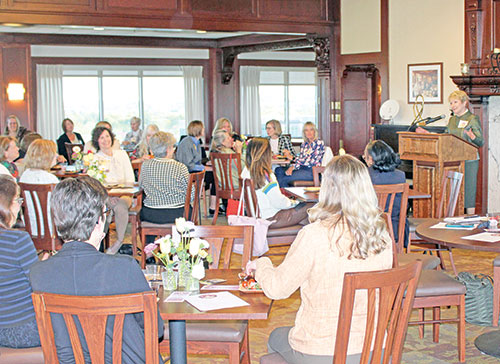 Sue Ellspermann, right, president of Ivy Tech Community College in Indianapolis, speaks with women of the archdiocese about women&rsquo;s philanthropy during a gathering at the college launching the archdiocese&rsquo;s Catholic Women&rsquo;s Giving Circle on April 24. (Photo by Jennifer Lindberg)