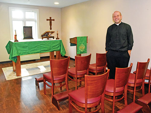 Father Andrew Syberg stands on Aug. 1, 2023, in a chapel for first-year seminarians at Bishop Simon Brut&eacute; College Seminary in Indianapolis. He was recently appointed as the new rector of the archdiocesan-sponsored seminary. (File photo by Sean Gallagher)