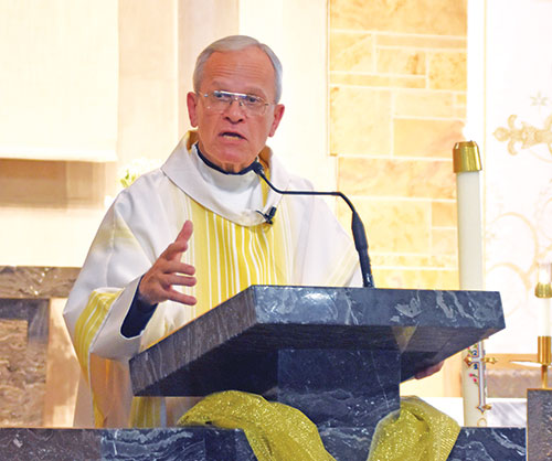 Msgr. Peter Vaccari, president of the New York-based Catholic Near East Welfare Association (CNEWA) and ex-officio chair of the board of trustees for the Pontifical Mission for Palestine, CNEWA&rsquo;s aid organization in the Middle East, preaches a homily on May 4 at St. Michael the Archangel Church in Indianapolis. (Photo by Natalie Hoefer)