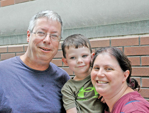 Ed and Joanne Portzer of the Diocese of Youngstown, Ohio, came to Indianapolis for the National Eucharistic Congress wanting their 3-year-old son Daniel &ldquo;to see so many people loving Jesus.&rdquo; (Photo by John Shaughnessy)