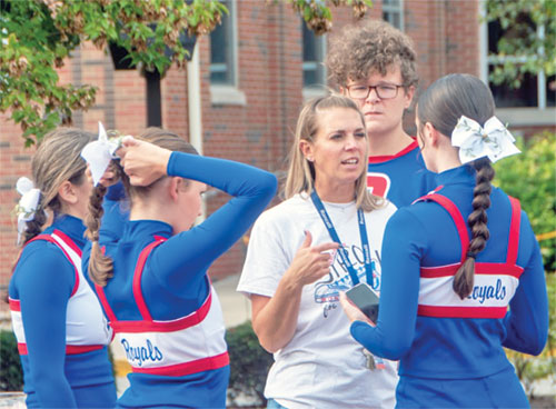 Roncalli High School&rsquo;s head cheerleading coach Jessica Engel talks with members of the Indianapolis school&rsquo;s cheerleading squad for the Sept. 6 football game against Bishop Chatard High School in Indianapolis. (Submitted photo)