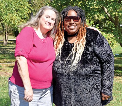 Savanna McPherson, right, smiles with Linda Kile, executive director and president of Great Lakes Gabriel Project, at Garfield Park in Indianapolis on Oct. 5. McPherson credits the organization and parish-based Gabriel Project volunteers with saving her now-21-year-old son from abortion and serving as &ldquo;the wind under&rdquo; her wings for two decades. (Photo by Natalie Hoefer)