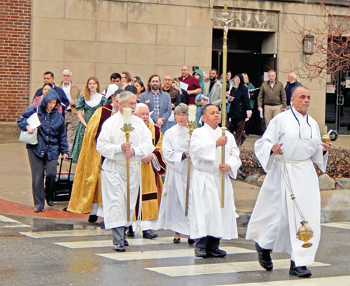 People process across Meridian Street from the Archbishop Edward T. O&rsquo;Meara Catholic Center to SS. Peter and Paul Cathedral on Dec. 29 after a prayer service to mark the start of the 2025 Jubilee Year, whose theme is &ldquo;Pilgrims of Hope.&rdquo; (Photo by Mike Krokos)