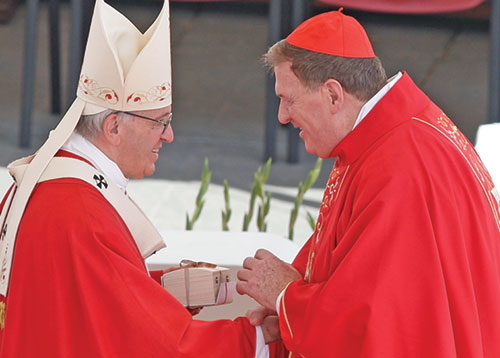 Pope Francis and Cardinal Joseph W. Tobin of Newark, N.J., share a moment of joy in 2017 when the pope gave the former archbishop of Indianapolis his pallium&mdash;a circular band made from lamb&rsquo;s wool that symbolized Cardinal Tobin&rsquo;s role as the shepherd of the Archdiocese of Newark and his communion with the pope. (CNS photo/Paul Haring)
