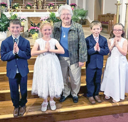 Betty Ripberger experiences the joy of being with four of her great-grandchildren&mdash;Camden, left, Emarie, Joel and Leah&mdash;on the day they received their first Communion at St. Mary Church in Rushville on May 4. (Submitted photo)