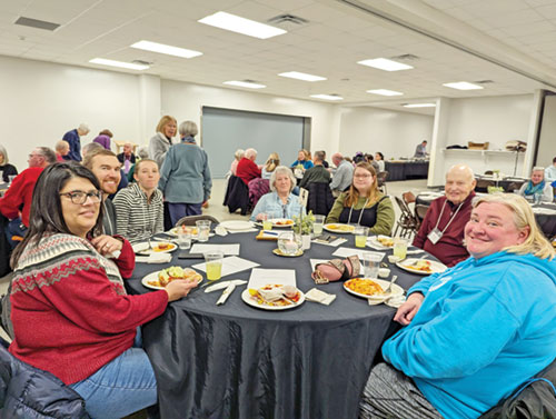 Participants in a &ldquo;Rescue Project&rdquo; evangelization program at St. Jude Parish in Indianapolis share a dinner during a Feb. 16 session at the Indianapolis South Deanery faith community. (Submitted photo)