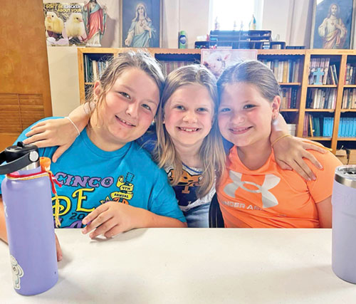 Maggie McBride, left, Katie Alley and Gabby Bickford show the joy that marked their involvement in the archdiocese&rsquo;s Totus Tuus program in the Tell City Deanery during summer vacation of 2024. (Submitted photo)
