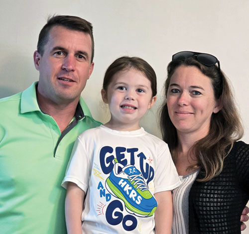 Widd, left, Elena and Jamie Lewis pose in a recent photo. The couple were welcomed into the full commmunion of the Church at St. Rose of Lima Church in Franklin on April 19. Elena attends the parish&rsquo;s pre-school.  (Submitted photo.)
