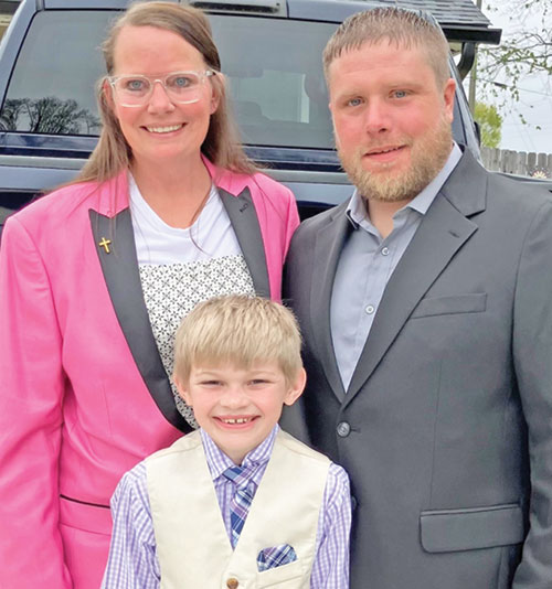Bethany, left, Xander and James Skaggs pose for a family photo before heading to St. Rose of Lima Church in Franklin on April 19 for the parish&rsquo;s Easter Vigil Mass, during which the family was welcomed into the full communion of the Church. (Submitted photo)