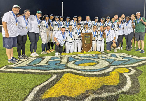 Players, coaches and managers of the girls&rsquo; softball team of Cathedral High School in Indianapolis celebrate their Class 3A state championship victory on June 14. (Photo courtesy of Oh Snap Indy)