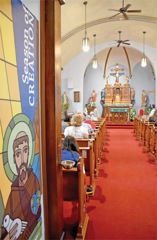Archbishop Charles C. Thompson delivers a homily in St. Thomas the Apostle Church in Fortville during the archdiocese&rsquo;s Season of Creation Mass on Sept. 4. (Photo by Natalie Hoefer)