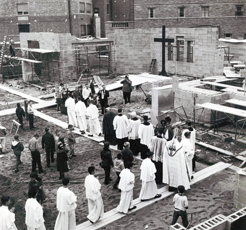 Archbishop Paul C. Schulte, priests and altar servers take part in a 1961 procession on the building site of St. Th&eacute;res&egrave; of the Infant Jesus (Little Flower) Church in Indianapolis to bless the cornerstone of the east side faith community&rsquo;s church. (Submitted photo)