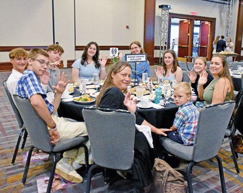 Members of the Boone County Gen 4 Life group wave at the camera during Right to Life of Indianapolis&rsquo; Celebrate Life dinner and fundraiser at the Indianapolis Marriott Downtown hotel on Sept. 25. (Photo by Natalie Hoefer)