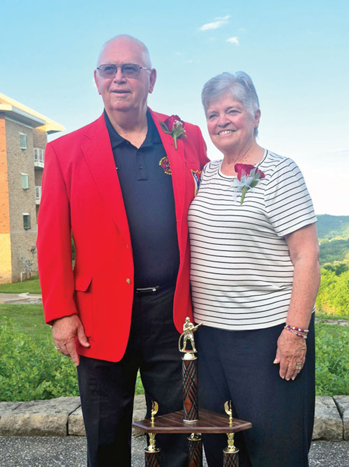 Larry and Martha Tempel of Annunciation Parish in Brazil pose in Madison in June after he was named Mr. IVFA&mdash;the Indiana Volunteer Firefighters Association&rsquo;s highest honor&mdash;during the organization&rsquo;s convention. The red jacket is a traditional part of the honor. For 53 years, the Tempels have served in numerous ways to better their community. (Submitted photo)