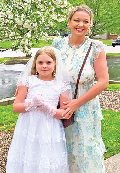 Mary, left, and Allyson Adams smile before the Easter Vigil Mass at St. Michael Church in Bradford on April 4, when Mary received the sacraments of baptism, confirmation and the Eucharist. (Submitted photo)