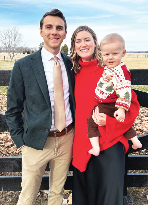 The archdiocese&rsquo;s new Catholic Community Foundation director Peter Duncan smiles with his wife Caroline and their son George in this 2025 Christmas photo. (Submitted photo)