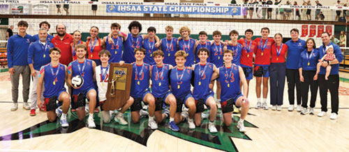 The players, coaches and managers of the boys&rsquo; volleyball team of Roncalli High School in Indianapolis are all smiles on June 6 at Lawrence North High School in Indianapolis as they celebrate winning the state championship. (Submitted photo)
