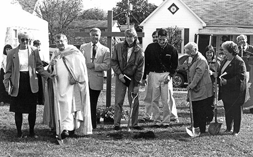 In this photo taken on Oct. 25, 1998, ground is broken for a new church building at St. Jude the Apostle Parish in Spencer. From 1951 to 1998, the parish worshiped in a house that had been converted into a church. Pictured are Father Paul Dede, pastor of the parish at that time, and members of the parish council and building committee. The new church was dedicated on May 14, 2000, and the original church building became the Paul M. Dede Parish Center.