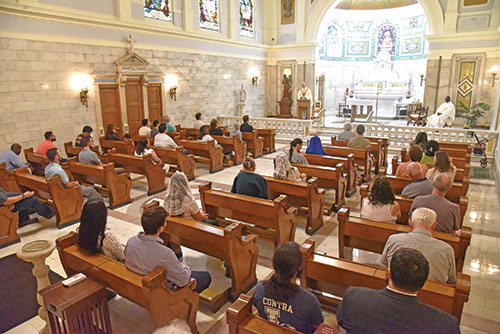 Worshippers fill the Blessed Sacrament Chapel of SS. Peter and Paul Cathedral in Indianapolis during a Mass on Aug. 6, the feast of St. John Vianney. The liturgy was the conclusion of a “Day of Prayer with St. John Vianney” for priestly vocations sponsored by the archdiocesan vocations office. (Photo by Sean Gallagher)