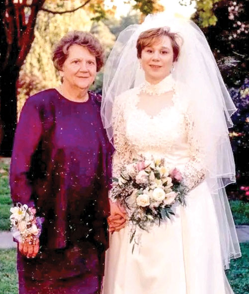 Ann Lewis shares a moment of joy with her mother, Mary Ann Goetz, on her wedding day in 1997. (Submitted photo)