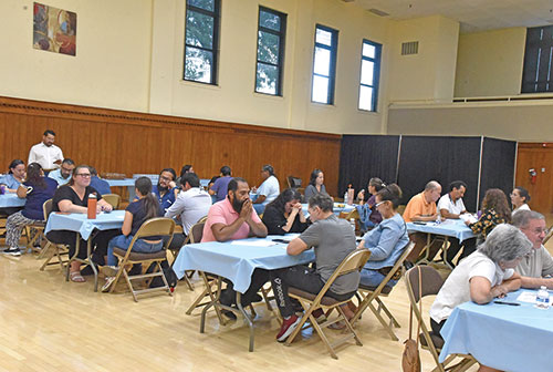 Participants take time for prayer and discussion on family life in the Church during a &ldquo;Listening Session for Parents&rdquo; held on Aug. 31 at the Archbishop Edward T. O&rsquo;Meara Catholic Center in Indianapolis. (Photo by Sean Gallagher)